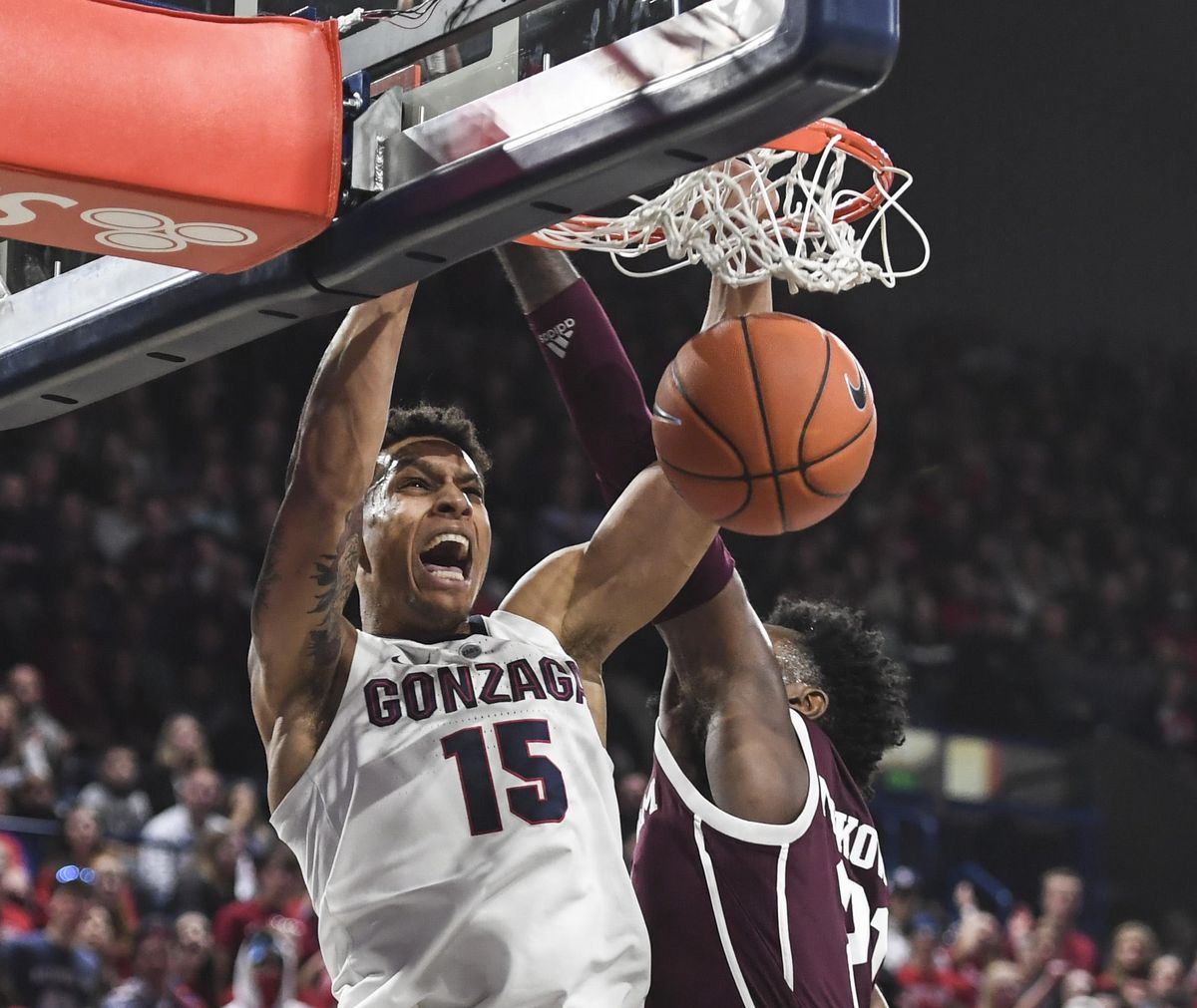 Gonzaga forward Brandon Clarke slams over Texas A&M forward Christian Mekowulu on Thursday in the McCarthey Athletic Center. (Dan Pelle / The Spokesman-Review)