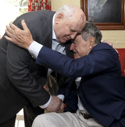 Former Soviet Union President Mikhail Gorbachev, left, and U.S. President George H.W. Bush meet Thursday. (Associated Press)