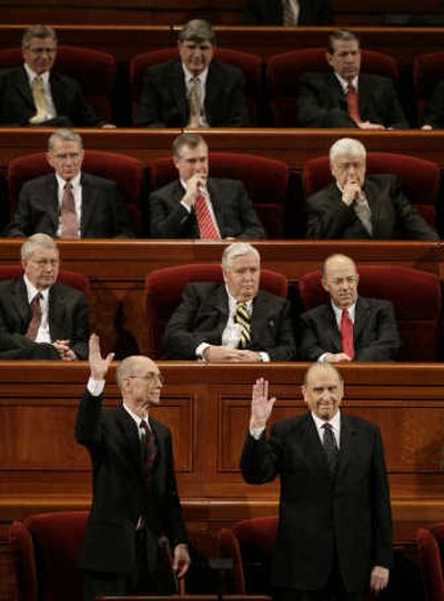 
Mormon church President Thomas S. Monson, lower right, and counselor Henry B. Eyring vote for themselves to lead the church at their spring conference Saturday in Salt Lake City. Associated Press
 (Associated Press / The Spokesman-Review)