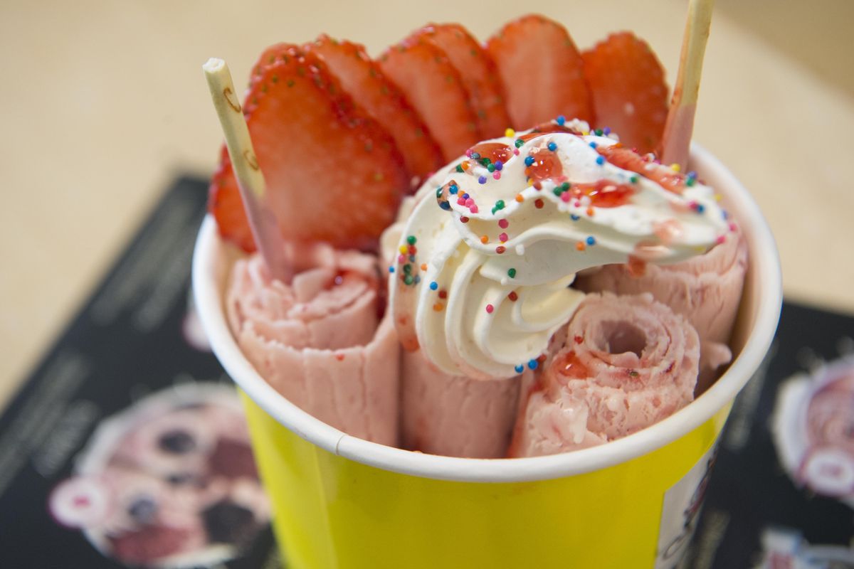 The Strawberry Lady at Yummy’s Ice Cream Rolls features fresh strawberries, whipped cream and sprinkles. (Jesse Tinsley / The Spokesman-Review)
