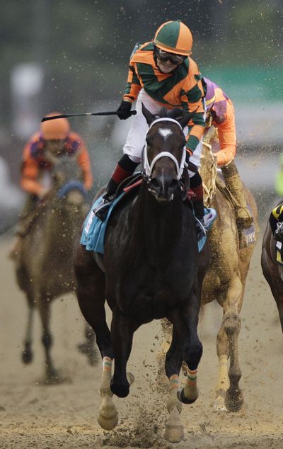 Rosie Napravnik rides Believe You Can to victory in the 138th running of the Kentucky Oaks on Friday. (Associated Press)