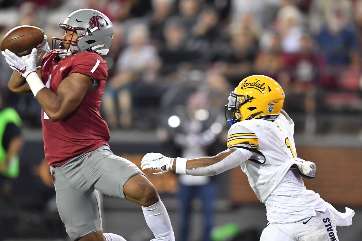 Washington State Cougars linebacker Daiyan Henley (1) intercepts a pass intended for Idaho Vandals wide receiver Jermaine Jackson (1) in the final moments of the second half of a college football game on Saturday, Sept. 3, 2022, at Martin Stadium in Pullman, Wash. WSU won the game 24-17. (Tyler Tjomsland/The Spokesman-Review)