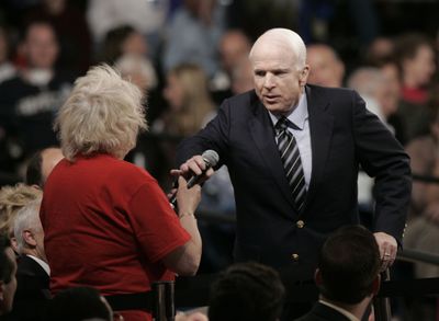 Sen. John McCain takes back the microphone from Gayle Quinnell, who said she had read that Sen. Barack Obama “was an Arab.” McCain was at a town hall meeting Friday in Minnesota. (Associated Press / The Spokesman-Review)