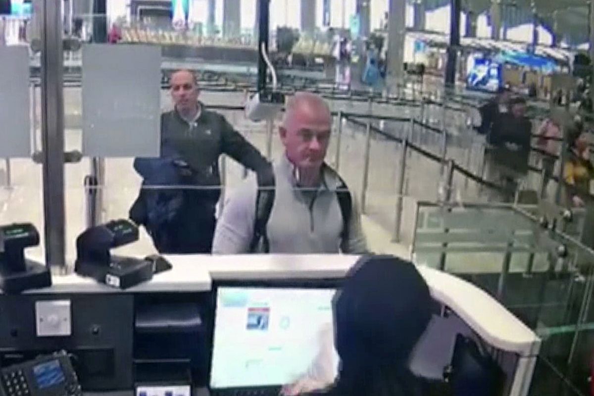 FILE—This Dec. 30, 2019 image from security camera video shows Michael L. Taylor, center, and George-Antoine Zayek at passport control at Istanbul Airport in Turkey. Taylor is accused of smuggling former Nissan Motor Co. Chairman Carlos Ghosn out of Japan in 2019 while he was awaiting trial on financial misconduct charges.  (SUB)
