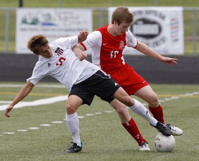 Sam Pizot, left, battles with Ferris’ Eric Hollenbaugh. (Steve Dipaola)