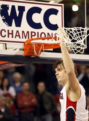 Gonzaga guard Matt Bouldin cuts down the net for WCC title.  (Associated Press)