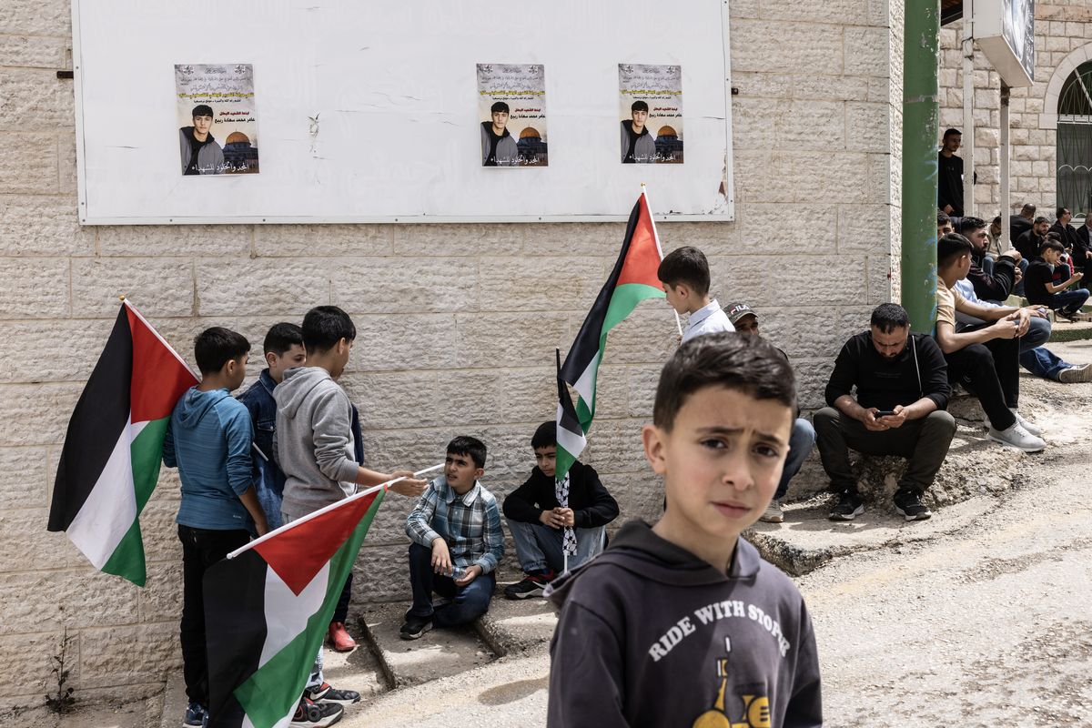 Boys wait outside a mosque during the funeral for Palestinian American Amer Rabee.   (Heidi Levine/For The Washington Post)
