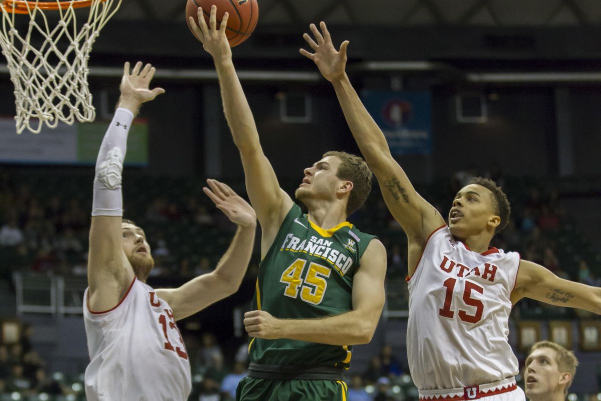 San Francisco guard Mladen Djordjevic  shoots a layup during the Dons’ win over Utah last month. (Eugene Tanner / Associated Press)