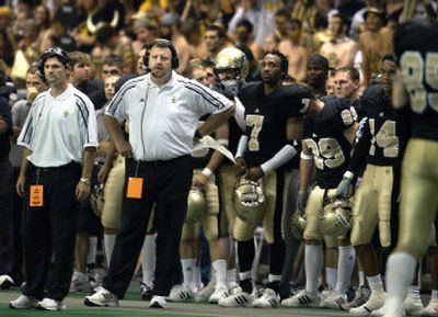 
Idaho head coach Tom Cable (hands on hips) watches as his Vandals lose to Boise State in his final season as UI head coach in 2003. 
 (File/ / The Spokesman-Review)