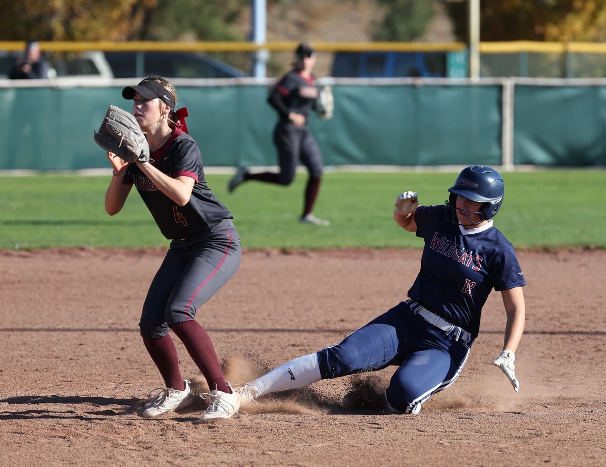 Mt. Spokane’s Riley Kinkaid beats the throw to second base in the State 3A/2A slowpitch softball title game in Yakima. The Wildcats defeated University 18-3 to clinch back-to-back titles.  (S. Carter Action Images)