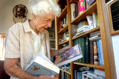 
Coeur d'Alene native Louise Shadduck looks through some of the books she has written.  Below, the four books she has authored are pictured. 
 (Jesse Tinsley / The Spokesman-Review)