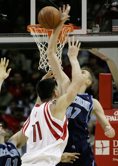 Houston’s Yao Ming has his shot blocked by Utah’s Andrei Kirilenko.  (Associated Press / The Spokesman-Review)