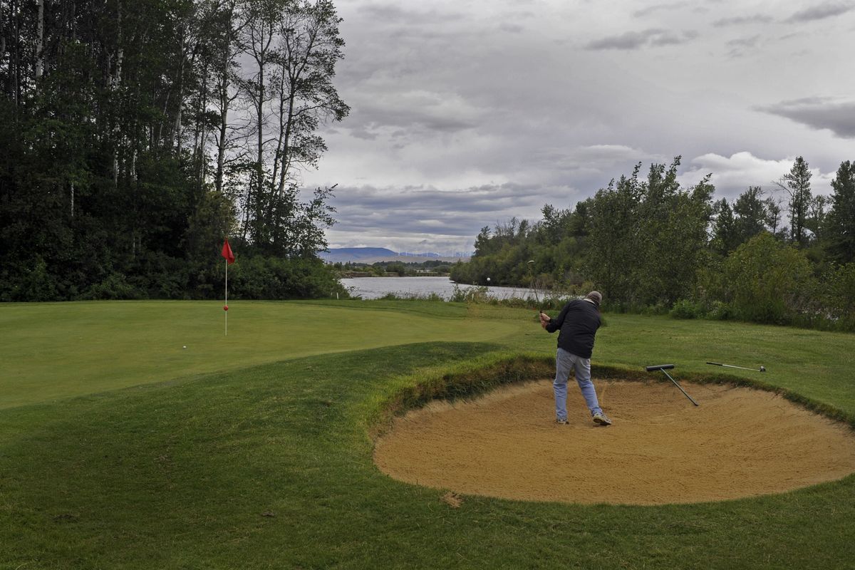 Small sand traps guard many of the greens at the Ellensburg Golf Course. (Christopher Anderson)