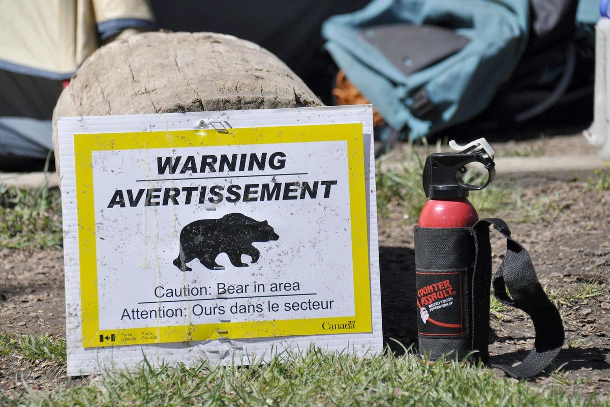 Hikers can expect to see bear warning signs posted at backcountry campsites in the Banff National Park area of the Canadian Rockies. Park backcountry rangers recommend carrying bear spray. (Rich Landers / The Spokesman-Review)