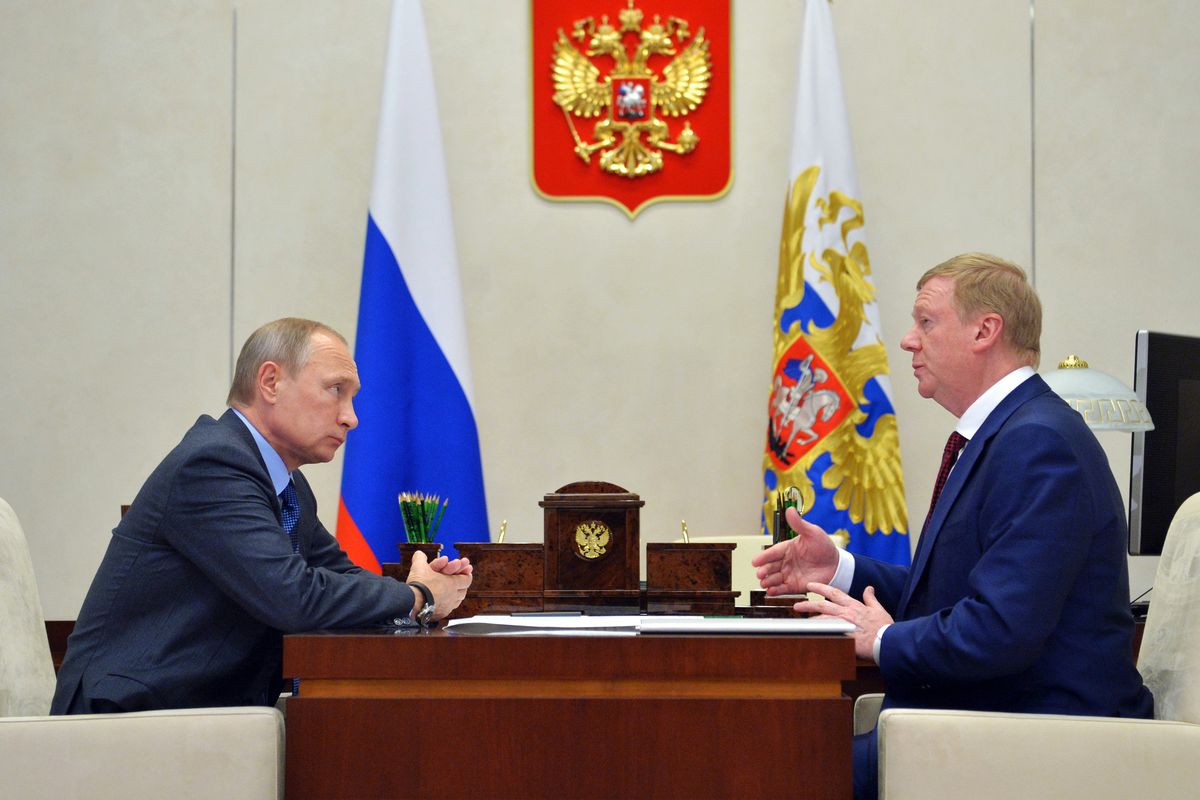 FILE - Russian President Vladimir Putin, left, listens to RUSNANO CEO Anatoly Chubais in the Novo-Ogaryovo residence, outside Moscow, Russia, Monday, Nov. 7, 2016. The resignation of Chubais, who was Putin