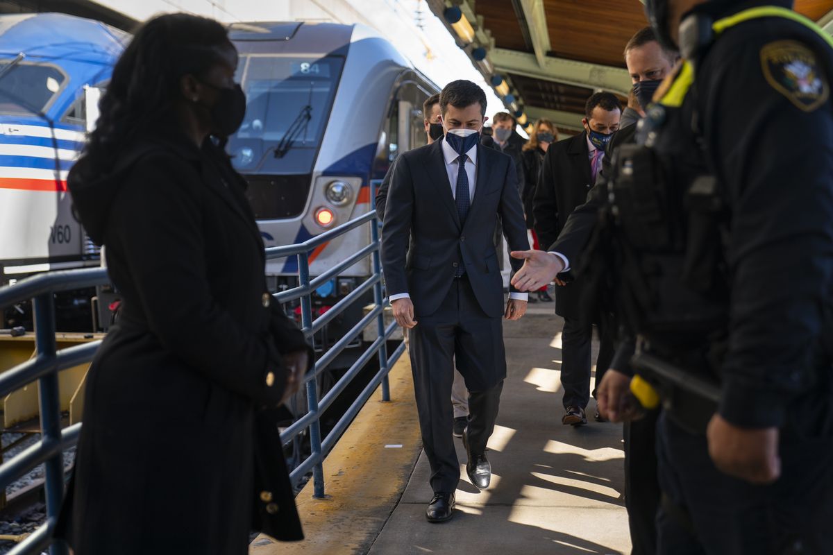 Transportation Secretary Pete Buttigieg walks from a train platform after visiting with Amtrak workers at Union Station in Washington, Friday, Feb. 5, 2021.  (Carolyn Kaster)
