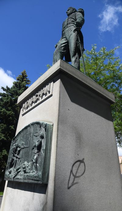 The John Monaghan statue at the corner of Riverside Avenue and Monroe Street has been tagged with spray paint. (DAN PELLE/THE SPOKESMAN-REVIEW)