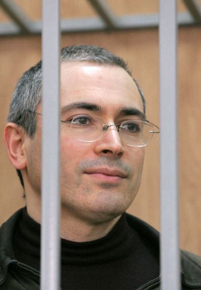 
Former CEO of Russian oil giant Yukos Mikhail Khodorkovsky stands behind bars during his trial, in this April 2005 photo. 
 (Associated Press / The Spokesman-Review)