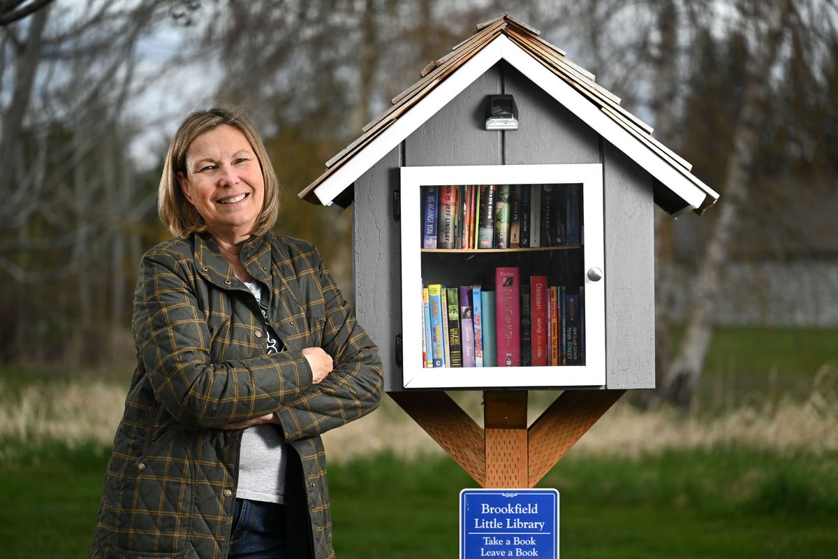 Cis Hyndman used her stimulus check to start the Brookfield Little Lending Library in the commons area of her Brookfield Estates housing development.  (COLIN MULVANY/THE SPOKESMAN-REVIEW)