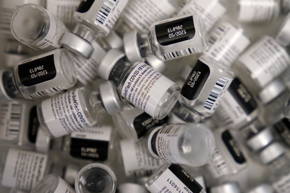 FILE - In this Jan. 22, 2021, file photo, empty vials of the Pfizer-BioNTech COVID-19 vaccine are seen at a vaccination center at the University of Nevada, Las Vegas, in Las Vegas. The makers of COVID-19 vaccines are figuring out how to tweak their recipes against worrisome virus mutations — if and when the shots need an update. (John Locher)