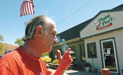 
Richard Morrisseau takes a smoke break outside of Poppa Paul's cafe in Pocatello, Idaho, which went smoke-free Monday. This restaurant was one of the last holdouts against Idaho's public smoking ban.
 (Associated Press / The Spokesman-Review)