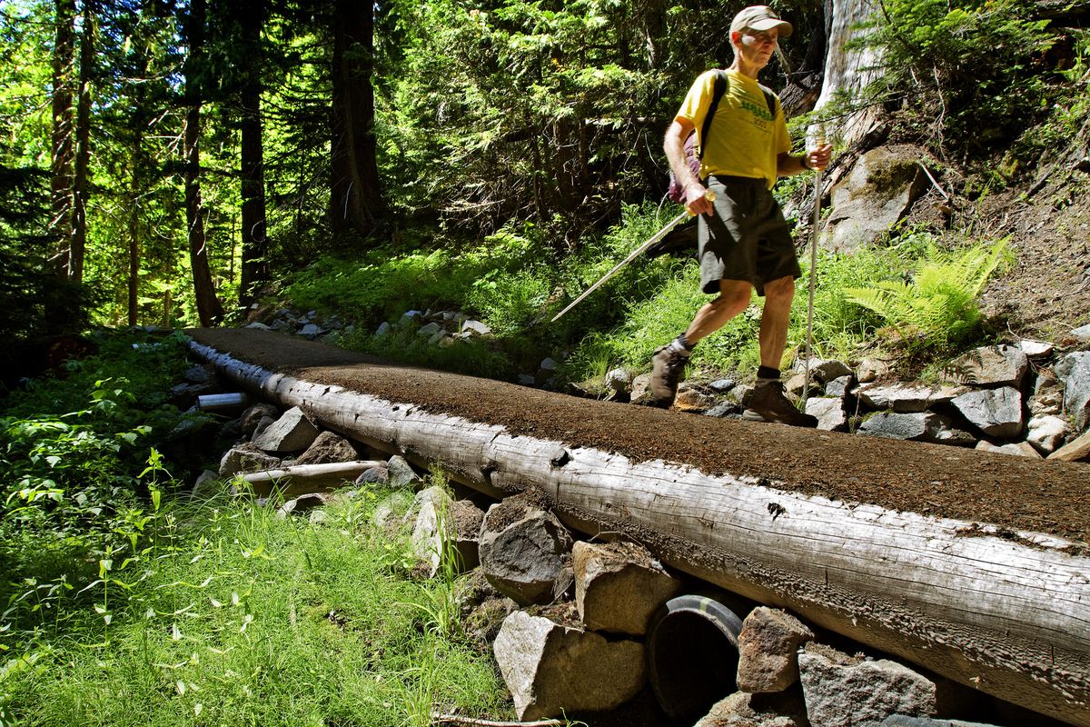 Jerry Thornell of Seattle hikes the Glacier Basin Trail in Mount Rainier National Park. The repaired trail was washed out several years ago when the White River flooded.