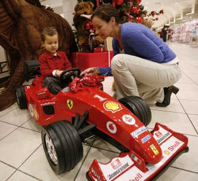 
Kelly Turula and her son Jack, 3, shop Thursday in the FAO Schwarz section at the Macy's store in Chicago. Associated Press
 (Associated Press / The Spokesman-Review)