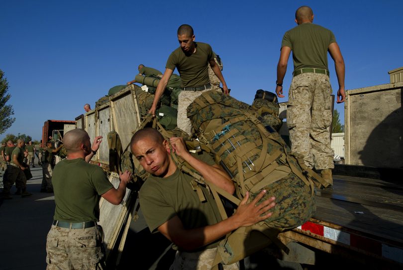 At the Manas Transit Center, Marines with the 2nd Battalion, 1st Marines, unload  gear in preparation for haeding down range in to Afghanistan Sunday, Oct. 17, 2010. (Colin Mulvany / The Spokesman-Review)