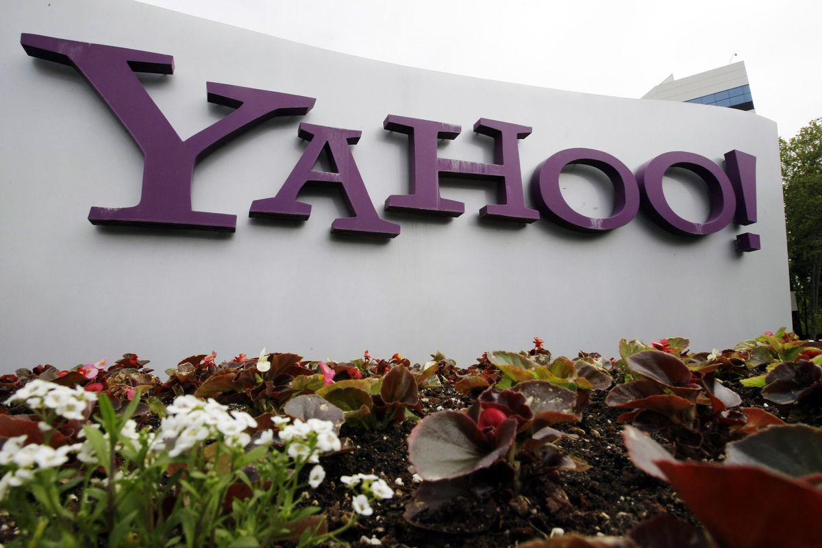 In this April 18, 2011 file photo, the Yahoo logo is seen outside of the offices in Santa Clara, Calif. A law enforcement official says the Justice Department is preparing to announce charges against four defendants, including two officers of Russian security services, in a mega data breach at Yahoo. (Paul Sakuma / Associated Press)