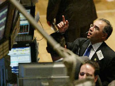 
A trader keeps an eye on stock prices at the New York Stock Exchange on Wednesday. 
 (Associated Press / The Spokesman-Review)
