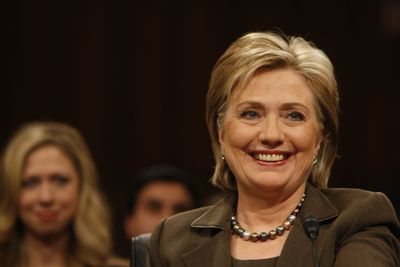 Secretary of State-designate Sen. Hillary Rodham Clinton, D-N.Y., smiles on Capitol Hill during her confirmation hearing Tuesday before the Senate Foreign Relations Committee. Her daughter, Chelsea, is at left.  (Associated Press / The Spokesman-Review)