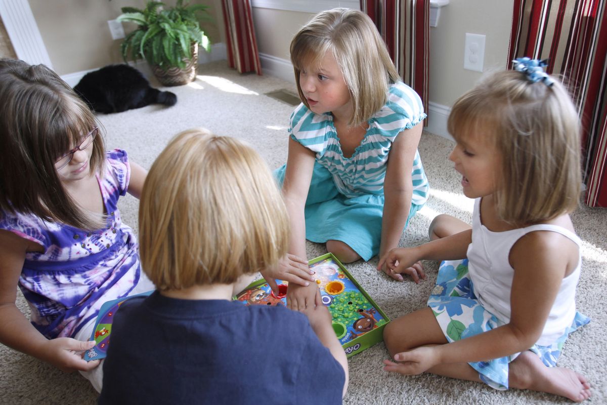 Karli Bossman, 8, center, plays with her siblings at her home in Clayton, N.C., Aug. 9. After an 11-doctor, three-psychologist odyssey through the medical system, she was dianosed with PANDAS, a condition triggered by strep infections and causes OCD.