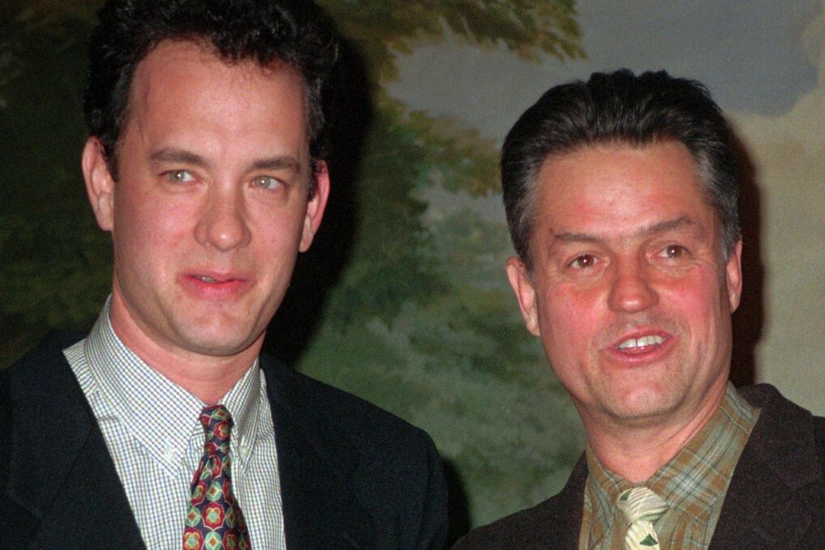 Filmmaker Jonathan Demme, right, is joined by actor Tom Hanks as Demme receives his 1994 GLAAD/NY Media Award at ceremonies in New York. Demme directed “Philadelphia,” which starred Hanks as a lawyer with AIDS. It was one of the first major Hollywood movies to deal with the AIDS crisis. (AUBREY REUBEN / Associated Press)