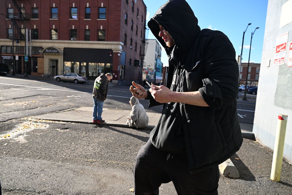 Blaine Blaire, right, has lived on the street for years and describes how enforcement of city camping rules has changed on Friday in Spokane.  (Jesse Tinsley/THE SPOKESMAN-REVIEW)