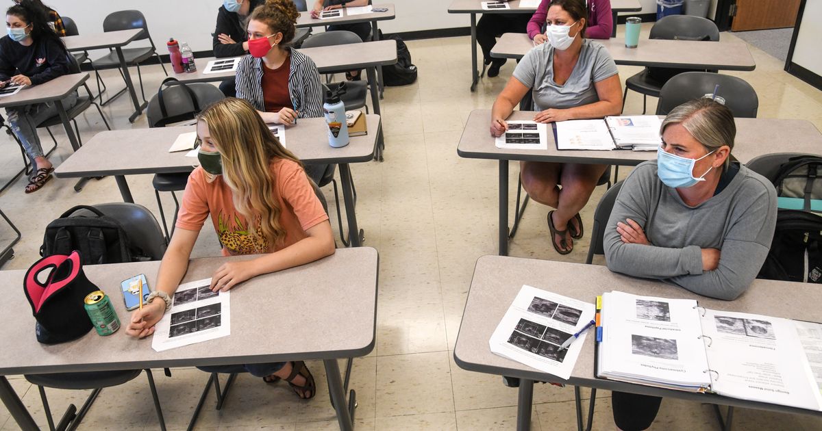 Masks required indoors again, as local hospitalizations and cases