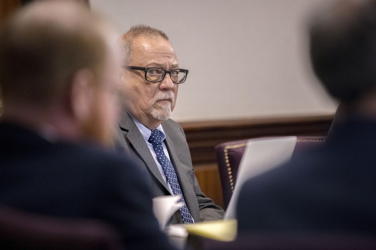 Greg McMichael, center, listens to arguments during the trial of himself, his son Travis McMichael, and a neighbor, William "Roddie" Bryan in the Glynn County Courthouse, Tuesday, Nov. 9, 2021, in Brunswick, Ga. The three are charged with the February 2020 slaying of 25-year-old Ahmaud Arbery.  (Stephen B. Morton)