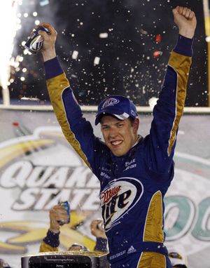 Brad Keselowski celebrates after winning at Kentucky Speedway. (Associated Press)