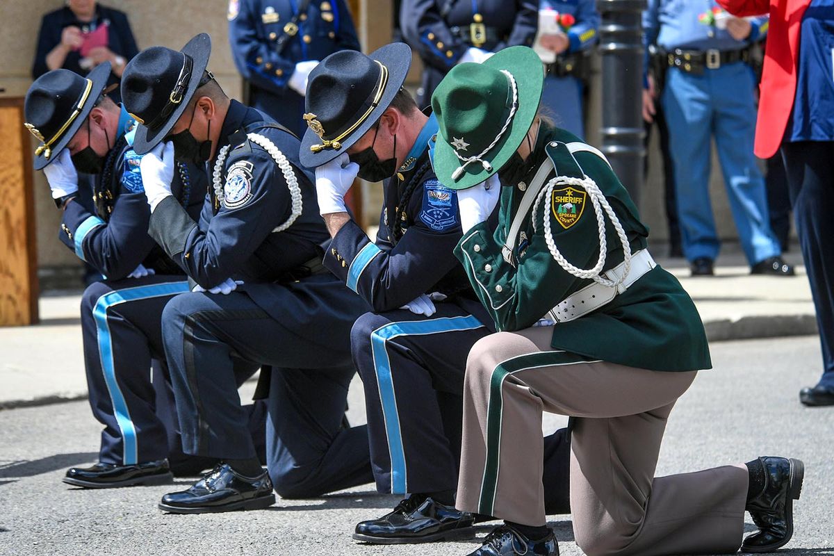 Honor Guard perform the Bell Salute for the fallen at the Law Enforcement Officers Memorial Project during the 33rd annual ceremony Tuesday at the Public Safety Building in Spokane.  (DAN PELLE/THE SPOKESMAN-REVIEW)