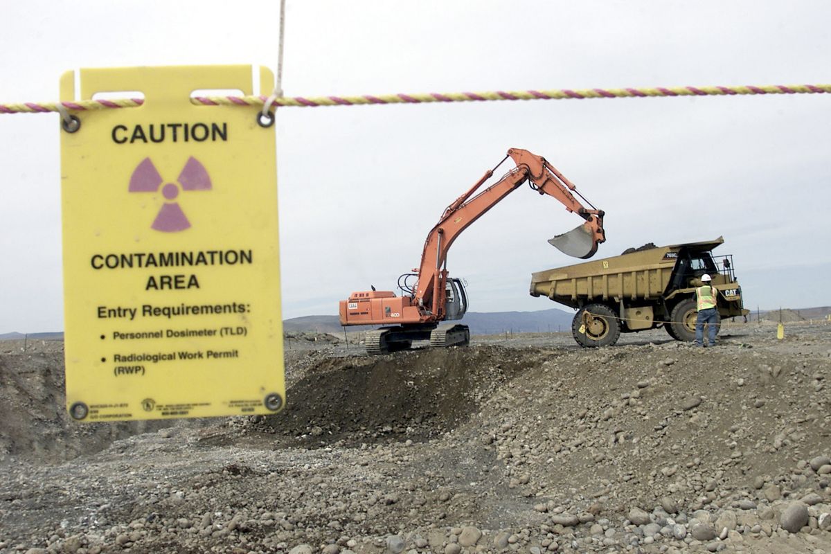 Workers remove waste in an area near two dormant nuclear reactors on the Hanford Nuclear Reservation near Richland in 2004. The world’s first full-scale nuclear reactor is one stop on tours of the southeastern Washington state reservation created as part of the Manhattan Project to build the atomic bomb. Now, more than two decades after it stopped producing plutonium, Hanford is the nation’s most contaminated nuclear site. (Associated Press)