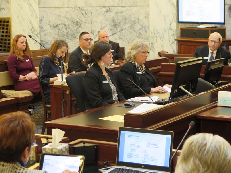 Idaho Division of Human Resources Administrator Susan Buxton, center right, addresses the Legislature's joint budget committee on Friday, Jan. 12, 2018; at center left is legislative budget analyst Robyn Lockett. (Betsy Z. Russell)