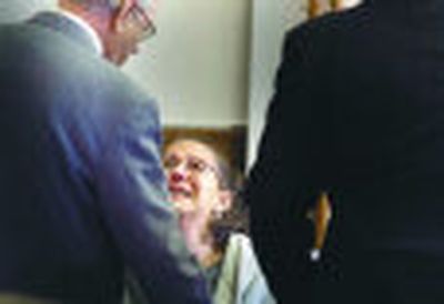 
Carole DeLeon is flanked by Stevens County sheriff's Detective Jerry Taylor, left, and her attorney, Carl Oreskovich, as she is taken into custody in court Tuesday in Colville. She was jailed for violating a no-contact order with her children as she awaits trial in the death of Tyler DeLeon. 
 (Christopher Anderson / The Spokesman-Review)
