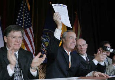 
Interior Secretary Dirk Kempthorne holds a  new Colorado River water use agreement  Thursday. Associated Press
 (Associated Press / The Spokesman-Review)