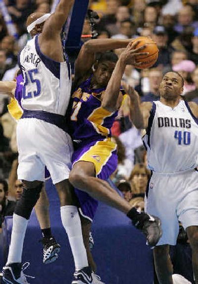 
Los Angeles Lakers center Andrew Bynum, center, fights for a rebound. 
 (Associated Press / The Spokesman-Review)