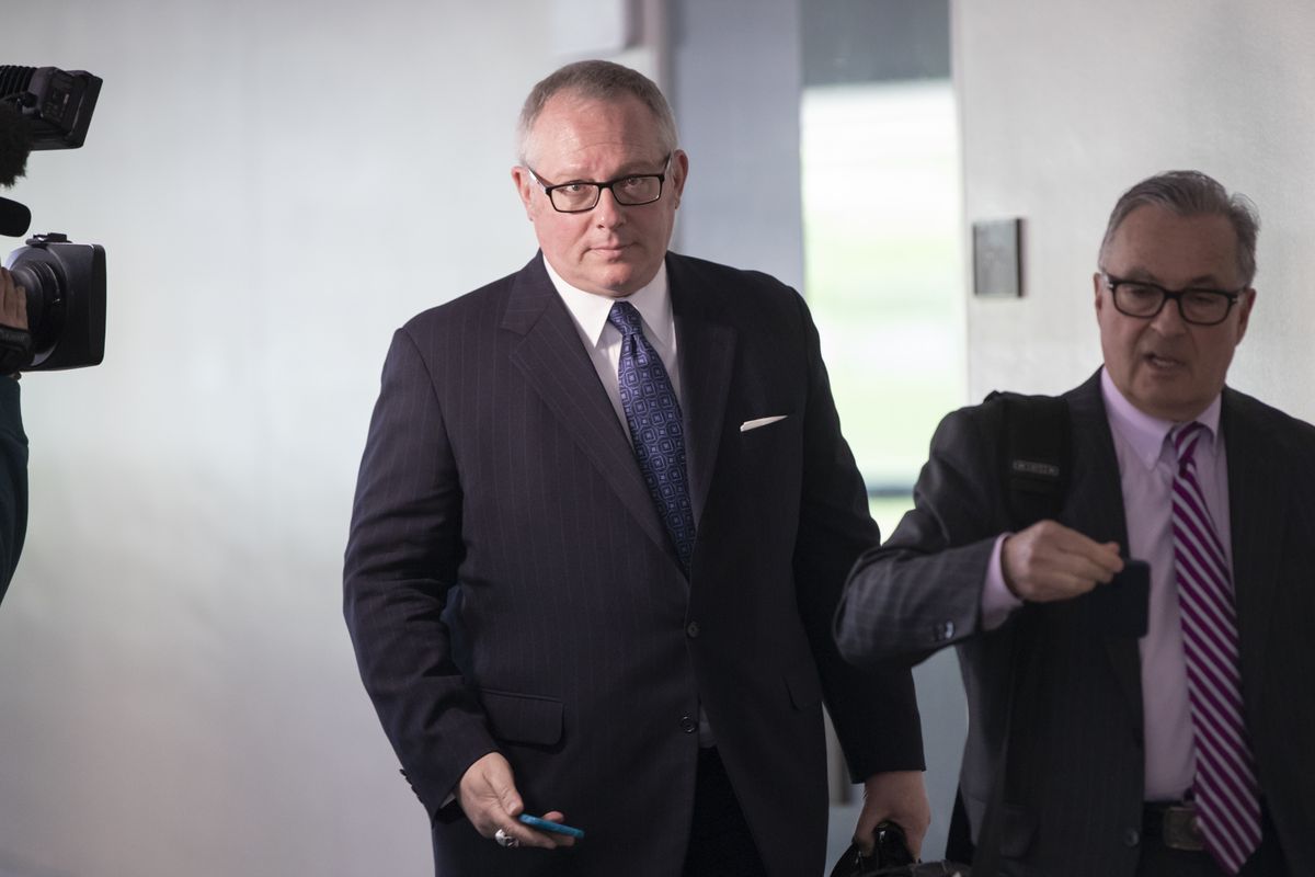 FILE - In this May 1, 2018, file photo, Former Donald Trump campaign official Michael Caputo, left, joined by his attorney Dennis C. Vacco, leaves after being interviewed by Senate Intelligence Committee staff investigating Russian meddling in the 2016 presidential election, on Capitol Hill in Washington. A House subcommittee examining President Donald Trump’s response to the coronavirus pandemic is launching an investigation into reports that political appointees have meddled with routine government scientific data to better align with Trump’s public statements. The Democrat-led subcommittee said Sept. 14, 2020 that it is requesting transcribed interviews with seven officials from the Centers for Disease Control and Prevention and the Department of Health and Human Services, including communications aide Michael Caputo.  (J. Scott Applewhite)