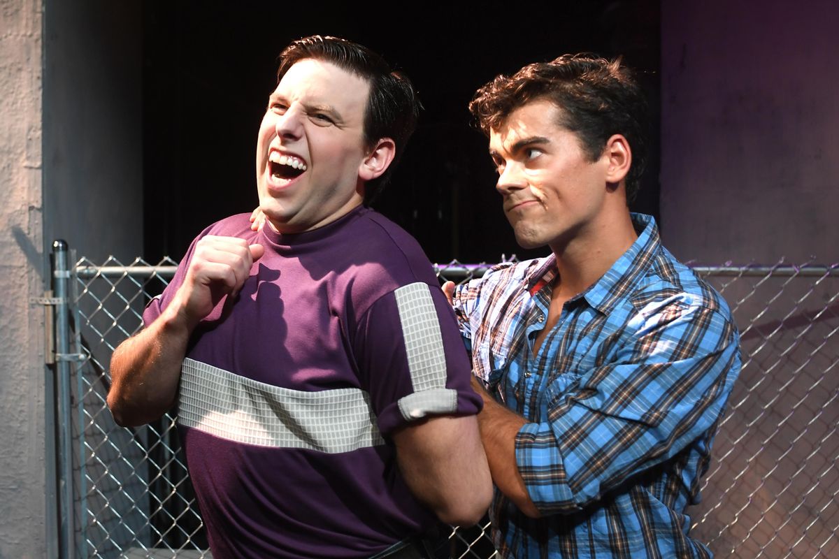 Tony, right, played by Duncan Menzies, twists the arm of his friend Riff, played by Preston Loomer, in a scene from the Spokane Civic Theatre’s production of “West Side Story,” which opens Friday. (Jesse Tinsley / The Spokesman-Review)