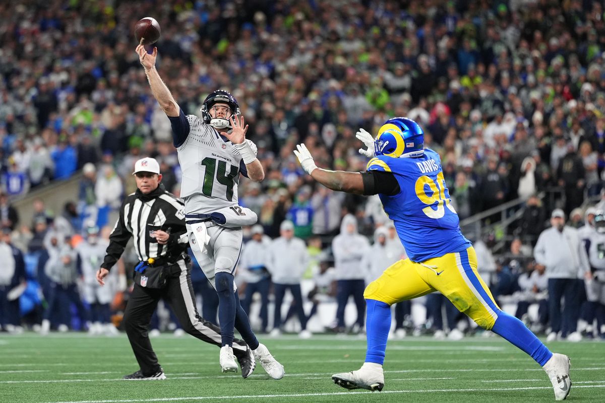 Seahawks quarterback Sam Darnold throws against the Rams on Thursday at Lumen Field in Seattle. (Getty Images)