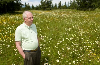 Human rights activist Tony Stewart stands  at the site of the former Aryan Nations compound near Hayden,  which is now a peace park.  (Colin Mulvany / The Spokesman-Review)