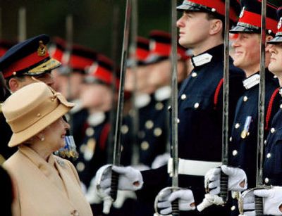 
Britain's Prince Harry, second from right, grins and his grandmother Queen Elizabeth II smiles, during ceremonies Wednesday at the Royal Military Academy in Sandhurst, England. 
 (Associated Press / The Spokesman-Review)