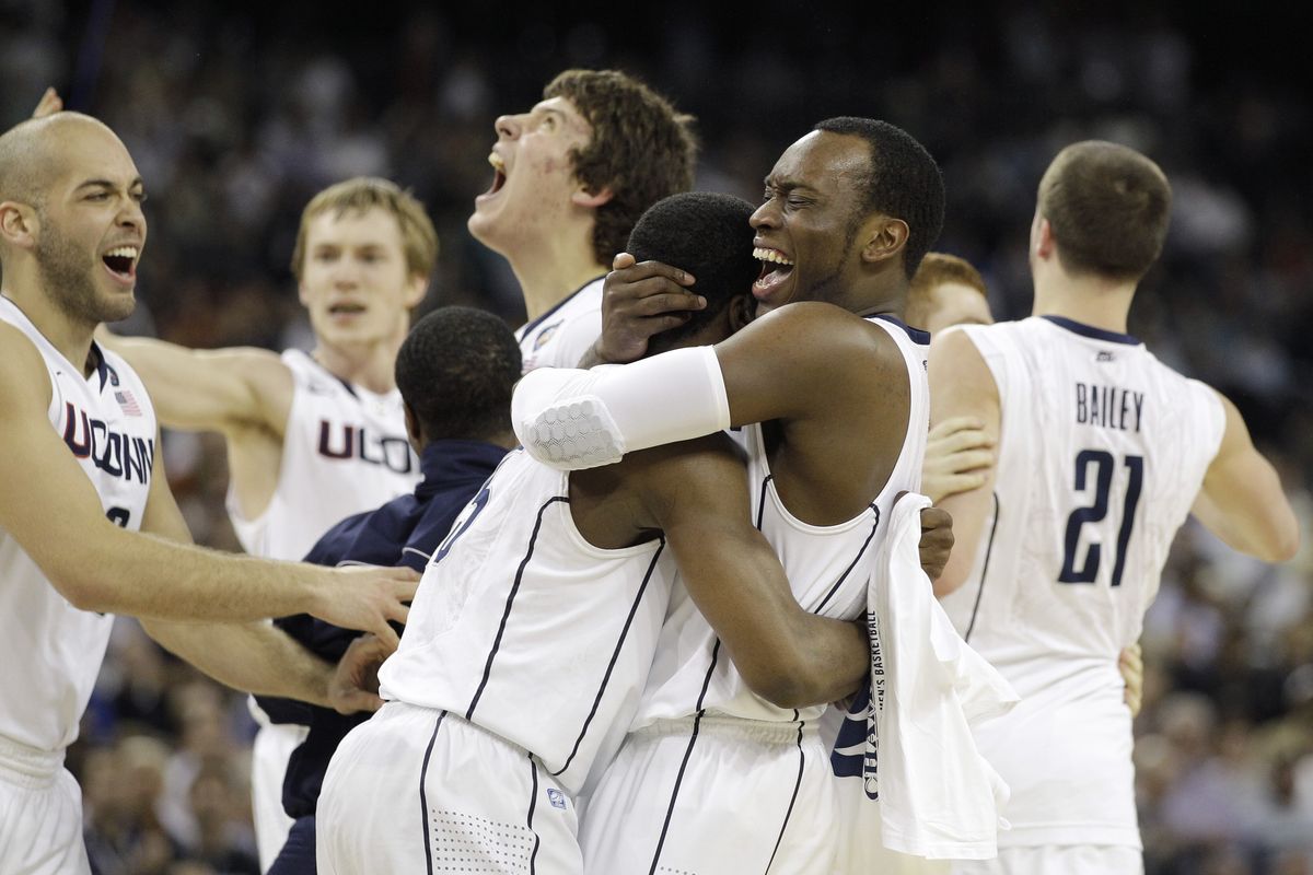 Connecticut players celebrate the Huskies’ third NCAA men’s national championship Monday night on a 53-41 win over Butler in Houston. (Associated Press)
