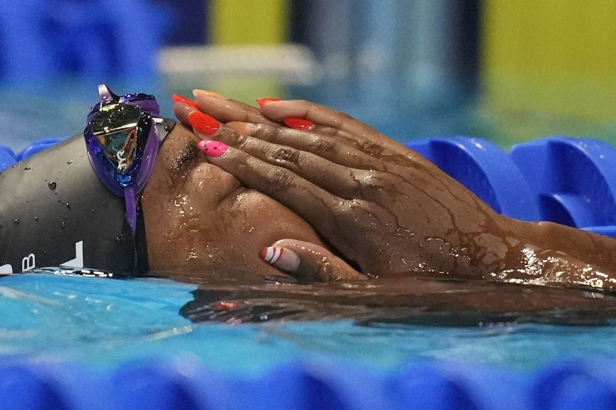 Simone Manuel reacts after the women